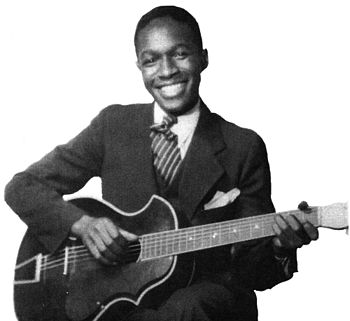 Josh White with his acoustic guitar, 1935